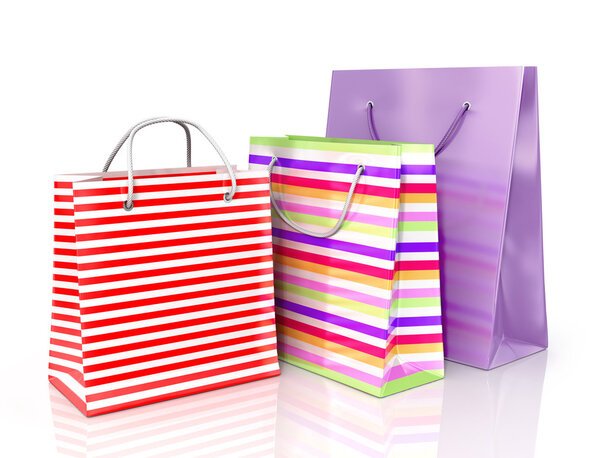 Colorful paper bags for shopping on a white background.