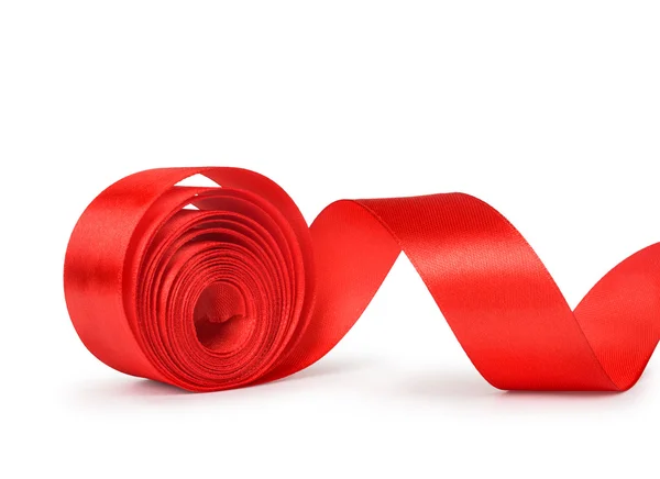 O rolo desenrolado de fita vermelha isolada no fundo branco — Fotografia de Stock