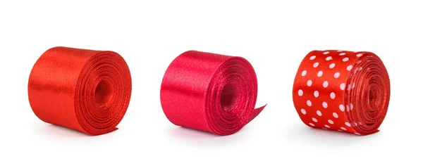 A collection of rolls of red ribbon isolated on white background — Stock Photo, Image