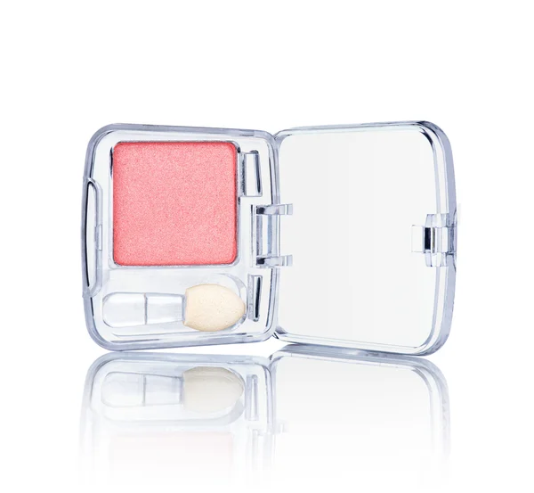 Pink eyeshadow in a transparent package with reflection on an is — Stock Photo, Image