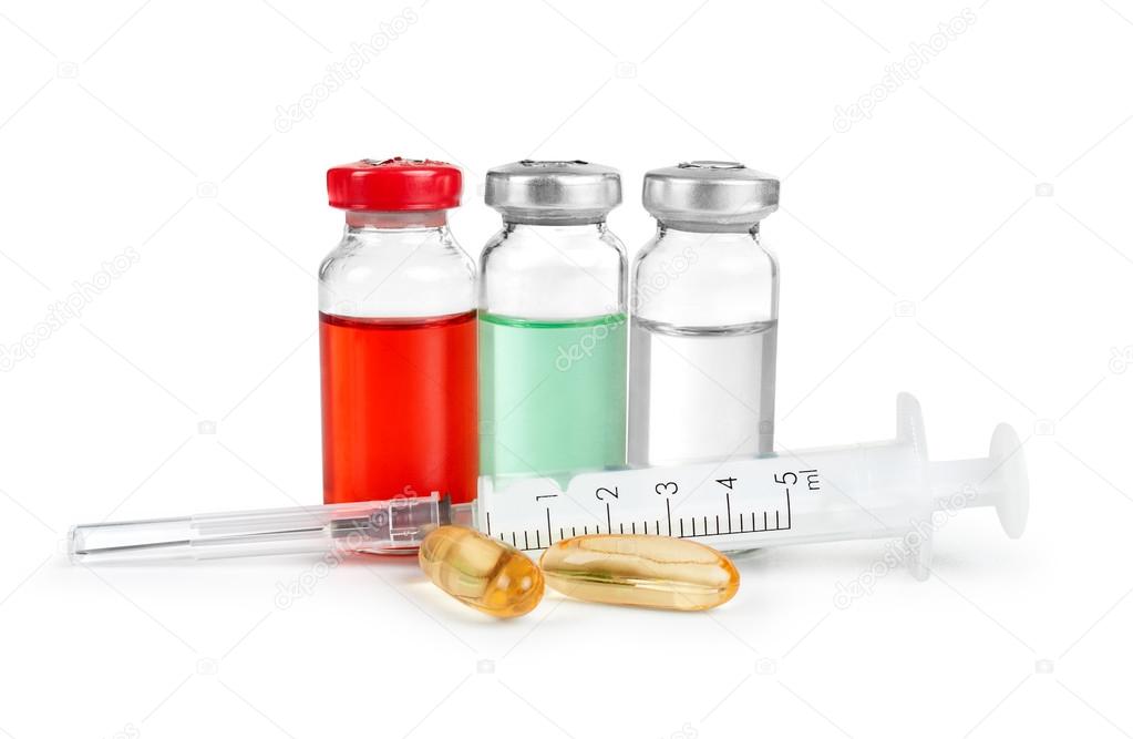 Syringe and medical ampoules, pils isolated on white