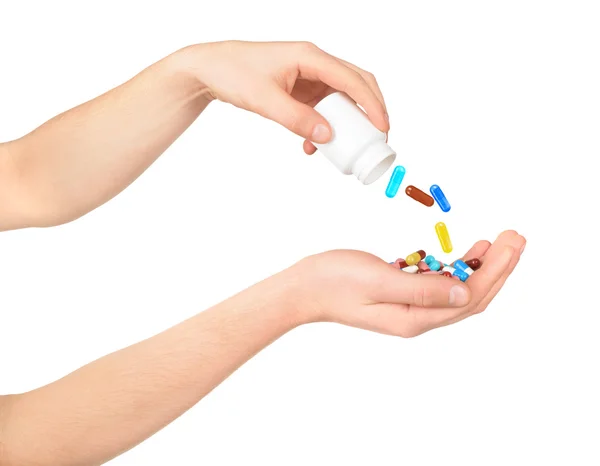 Man's hand holding a medicine pills isolated on white — Stock Photo, Image
