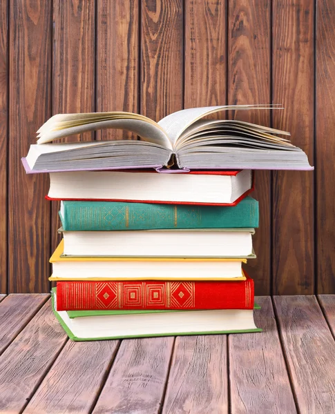 Books on a wooden background — Stock Photo, Image