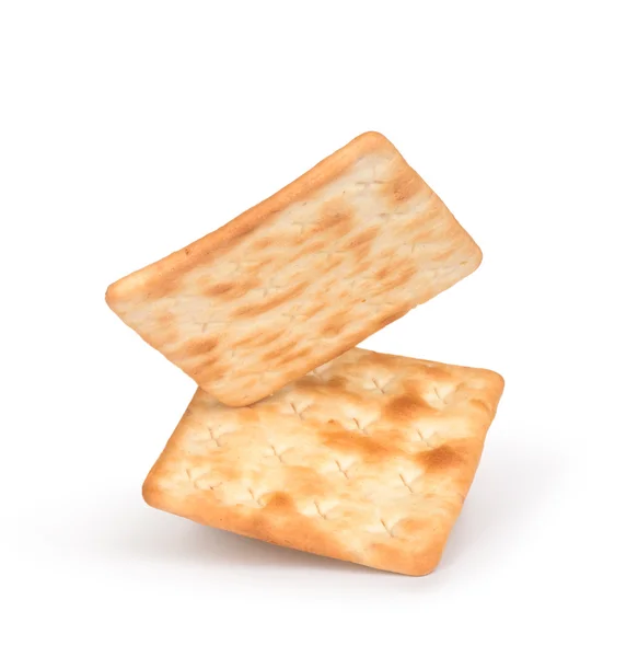 Vallende vierkante crackers geïsoleerd op witte achtergrond — Stockfoto