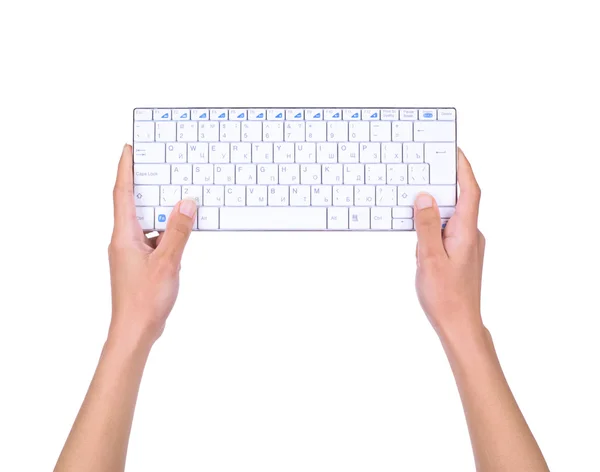 Female hands holding the keyboard isolated on white — Stock Photo, Image