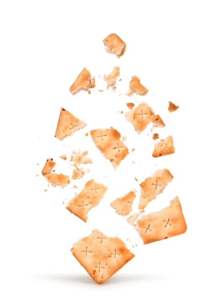 Die Explosion des Crackers in Stücke isoliert auf weißem Backg — Stockfoto