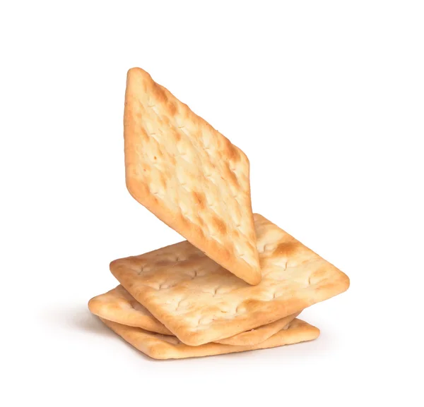 Der fallende Stapel quadratischer Cracker isoliert auf weißem Hintergrund — Stockfoto
