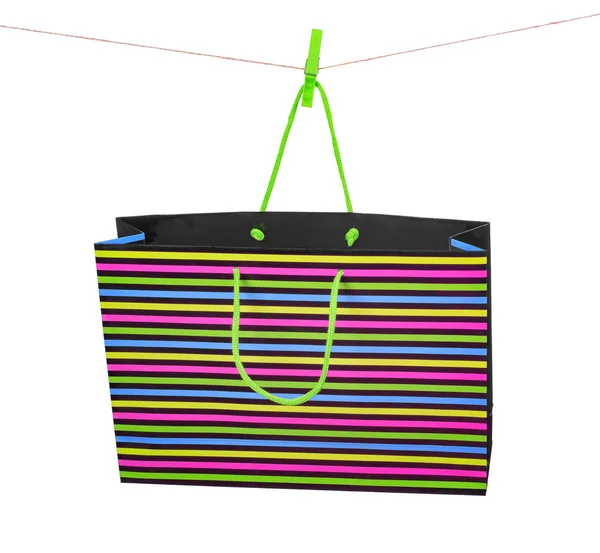 Shopping väska på en lina isolerad på vit — Stockfoto