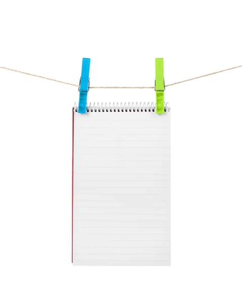 Exercise book on a rope isolated on white — Stock Photo, Image