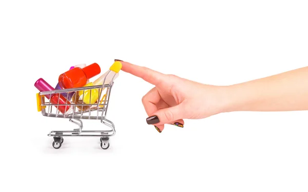 Mano empujando carretilla con esmalte de uñas aislado en blanco — Foto de Stock