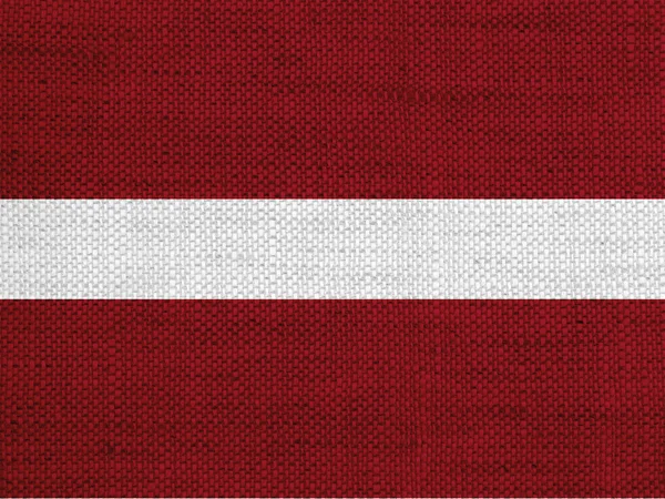 Bandera de Letonia sobre lino viejo — Foto de Stock