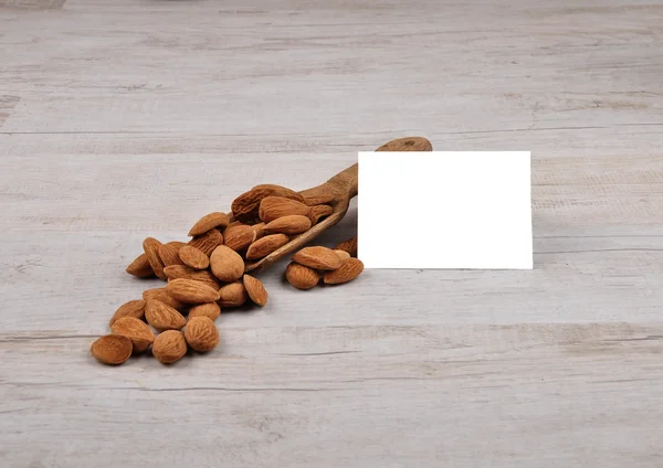 Almonds on shovel — Stock Photo, Image