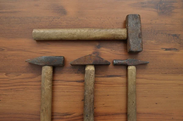 Hammer on wood — Stock Photo, Image