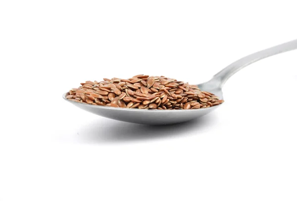 Flax seed on spoon — Stock Photo, Image