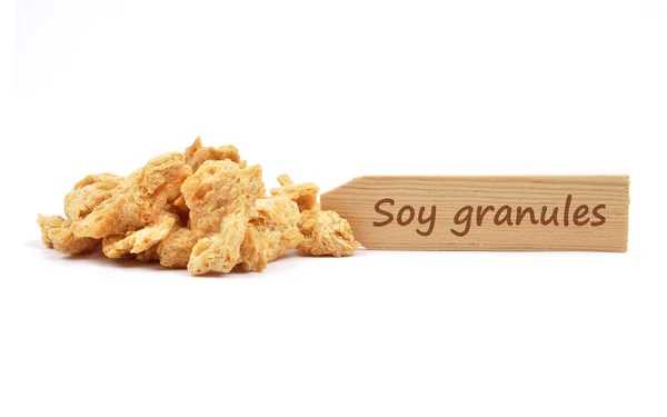 Soy granules at plate — Stock Photo, Image