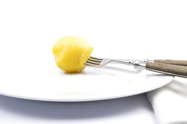 Peeled potato on table — Stock Photo, Image