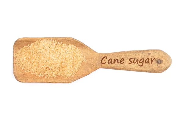 Brown cane sugar on shovel — Stock Photo, Image
