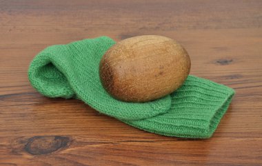 Darning egg with hand-knitted sock clipart