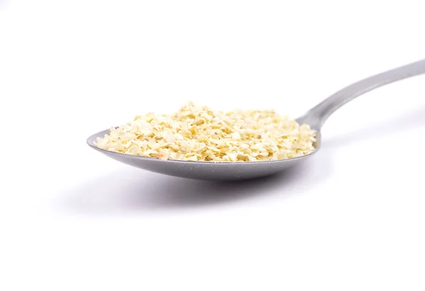 Millet flakes on spoon — Stock Photo, Image