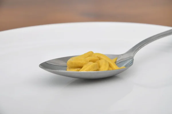 Spoon with mustard — Stock Photo, Image