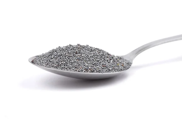 Poppy seeds on spoon — Stock Photo, Image