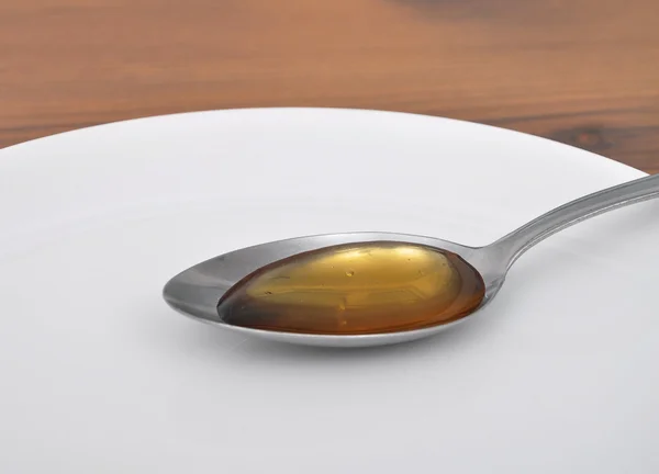 Cucchiaio con miele — Foto Stock