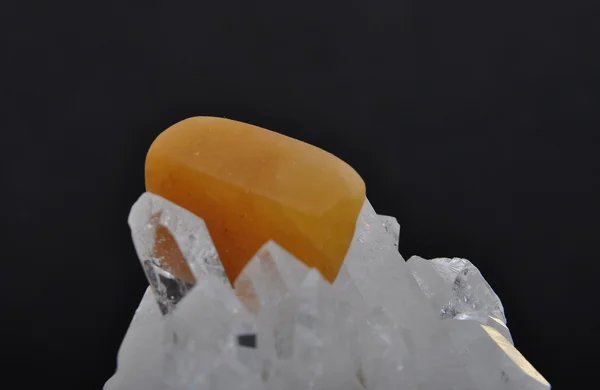 Orange calcite on rock crystal — Stock Photo, Image