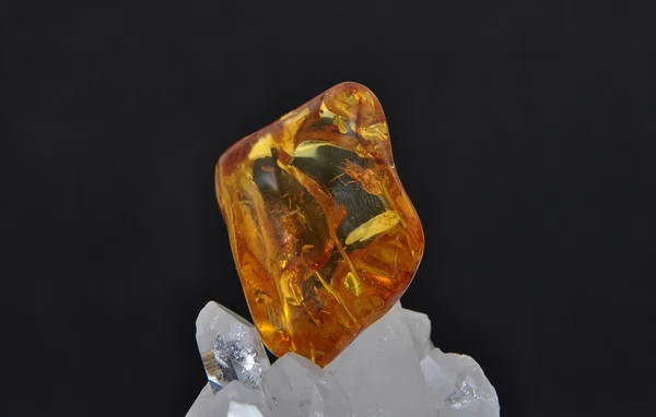 Amber on rock crystal — Stock Photo, Image
