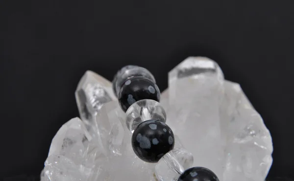 Obsidian on rock crystal — Stock Photo, Image