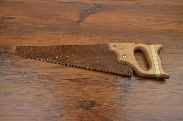 Hand saw on wood — Stock Photo, Image