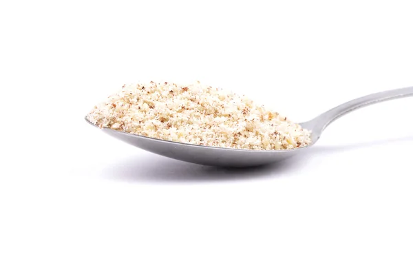 Hazelnuts powdered on spoon — Stock Photo, Image