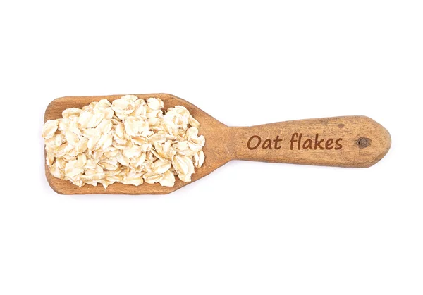 Oat flakes on shovel — Stock Photo, Image