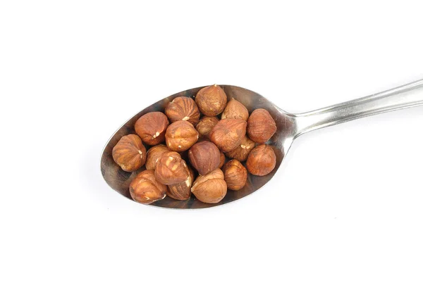 Hazelnuts  on spoon — Stock Photo, Image