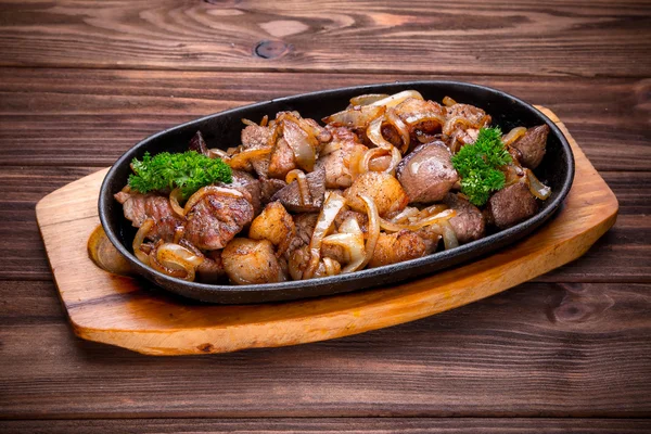 Frying pan with roasted meat and onion — Stock Photo, Image