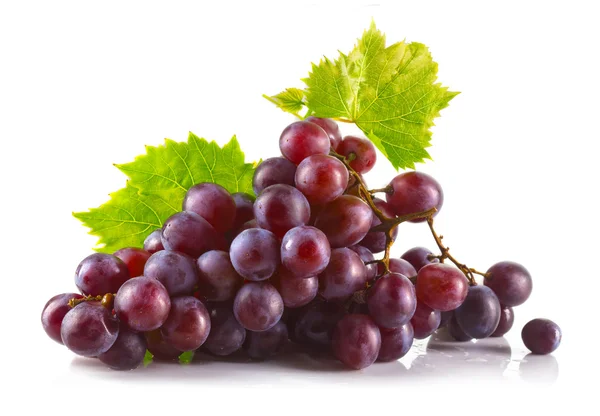 Bunch of ripe red grapes with leaves isolated on white — Stock Photo, Image