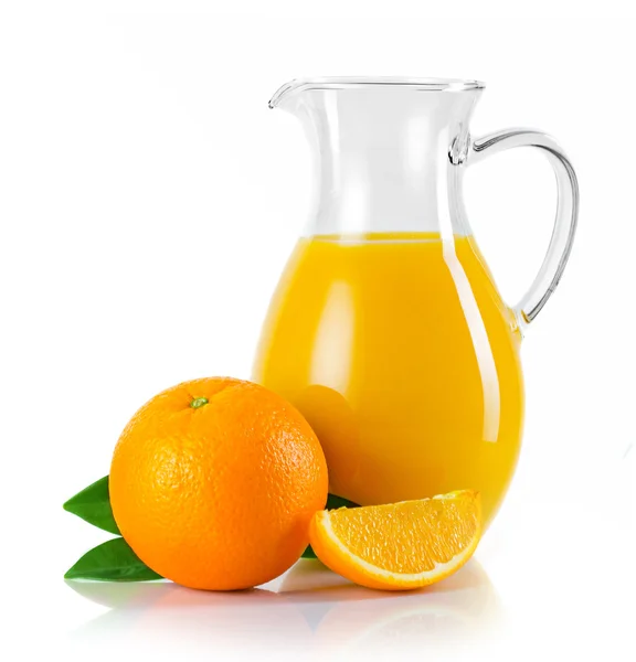 Jug with orange juice and fruits with green leaves isolated — Stock Photo, Image