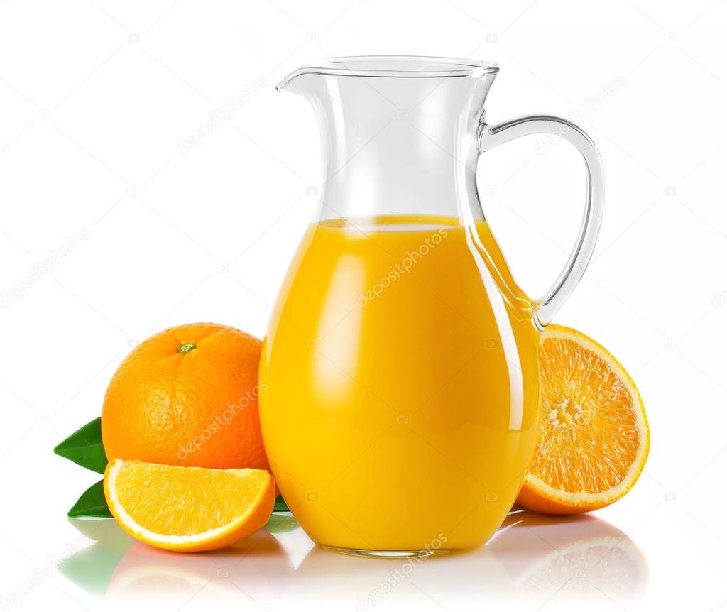 Jug with orange juice and fruits with green leaves isolated