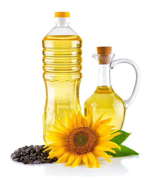 Jarro e Garrafa de óleo de girassol com flor e sementes isoladas — Fotografia de Stock