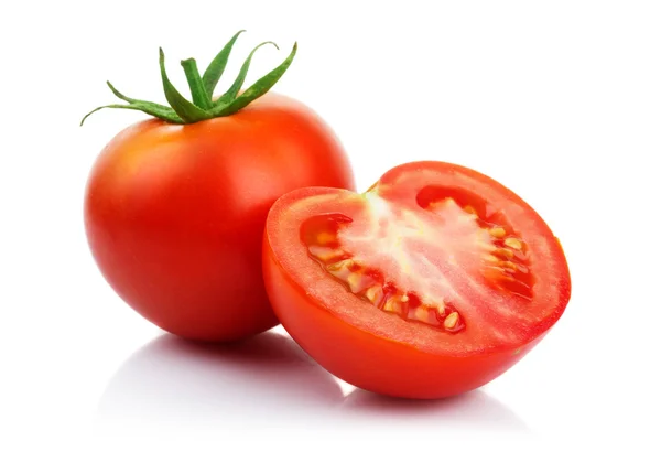 Tomates rojos con corte aislado en blanco Imagen de archivo