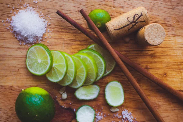 Lime slices, sugar, cork and Chinese sticks — Stock Photo, Image