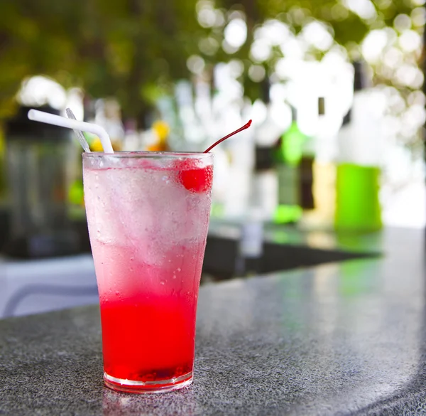 Strawberry red cocktail garnished with cherry — Stock Photo, Image