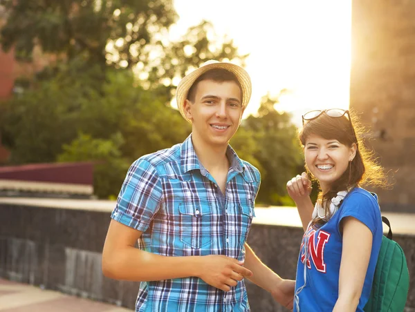 Cute young beautiful teens sitting in city near university after — Stock Photo, Image