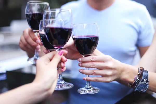 Close up of hands toasting in restaurant — Stock Photo, Image