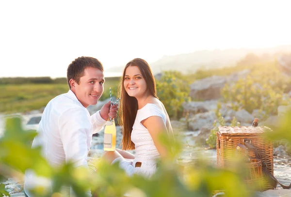 Young happy couple in love at the summer picnic — Stock Photo, Image