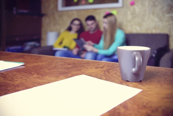 Business team hands at work with financial reports and a tablet — Stock Photo, Image