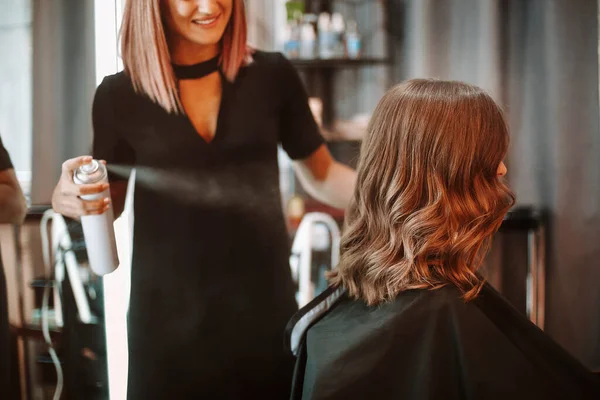 Professional Beautician Discussing Treatment Product Female Client While Standing Shelves — Stock Photo, Image