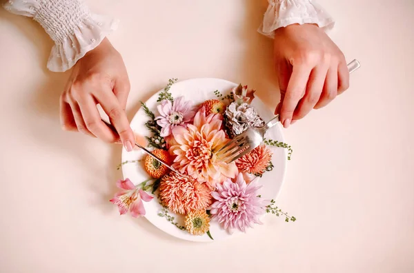 Top View Anonymous Female Fork Knife Cutting Eating Natural Flowers — Stock Photo, Image