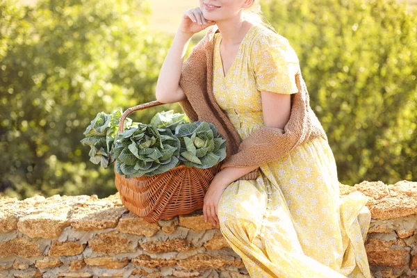 Unrecognizable Young Female Leaning Wicker Basket Fresh Cabbage Touching Face — Stock Photo, Image