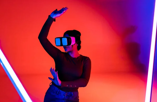 Happy Female Headset Smiling Exploring Virtual Reality Red Neon Illumination — Stock Fotó