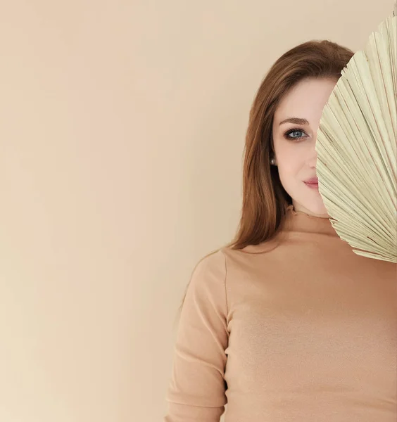 Young Female Looking Camera Covering Half Face Fan Beige Background — Stock Photo, Image